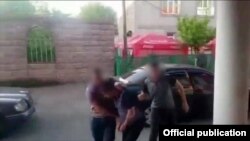 Armenia -- A screenshot of official video of police arresting one of the men allegedly involved in a high-profile shooting incident, May 30, 2019.
