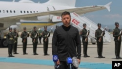 Ukrainian President Volodymyr Zelenskyy talks to journalists at Esenboga airport in Ankara on May 15.