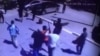 Момент одного из нападений предполагаемых боевиков в Актобе 5 июня 2016 года. Кадр видео. 