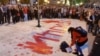 Боја како крв врз портретите на Груевски и Јанкулоска