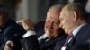 Belarus - Presidents Armen Sarkissian (L) of Armenia and Vladimir Putin of Russia attend the opening ceremony of the European Games in Minsk, June 20, 2019.