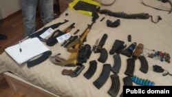 Armenia - An Investigative Committee photo of weapons confiscated from opposition activists, June 25, 2025.