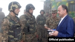Armenia - Defense Minister Seyran Ohanian (R) awards soldiers on frontline duty.