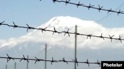 Barbed wire, pictured against the backdrop of Mount Ararat, marks Armenia's closed border with Turkey.